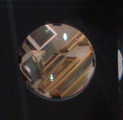 200-10 crop through lense showing studio wall